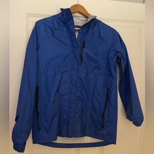 REI - Blue rain jacket.
